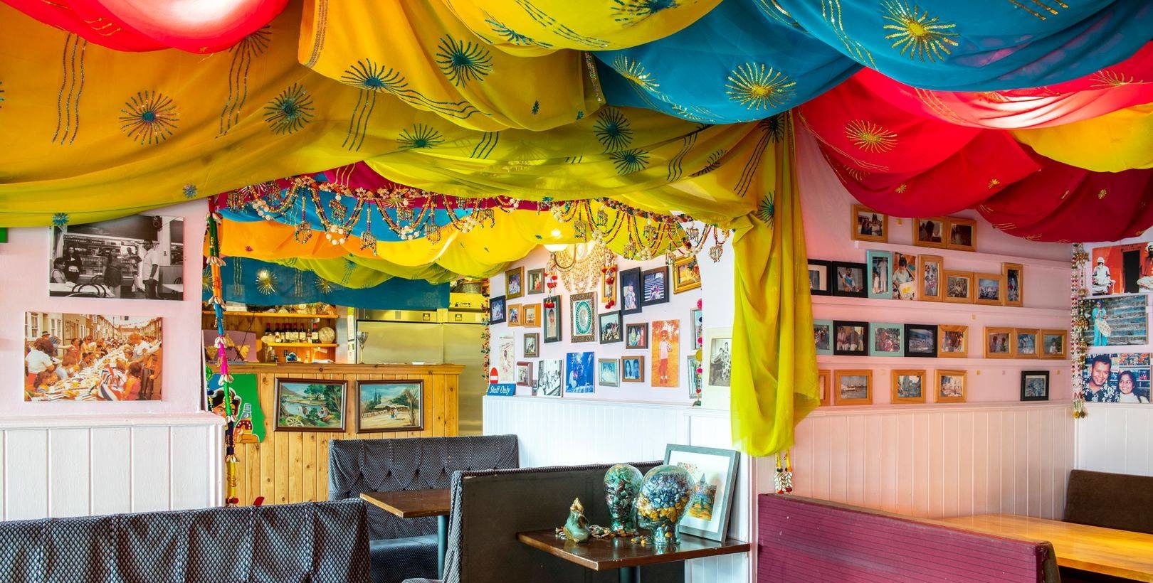 colorful tapestries hanging from ceiling inside room