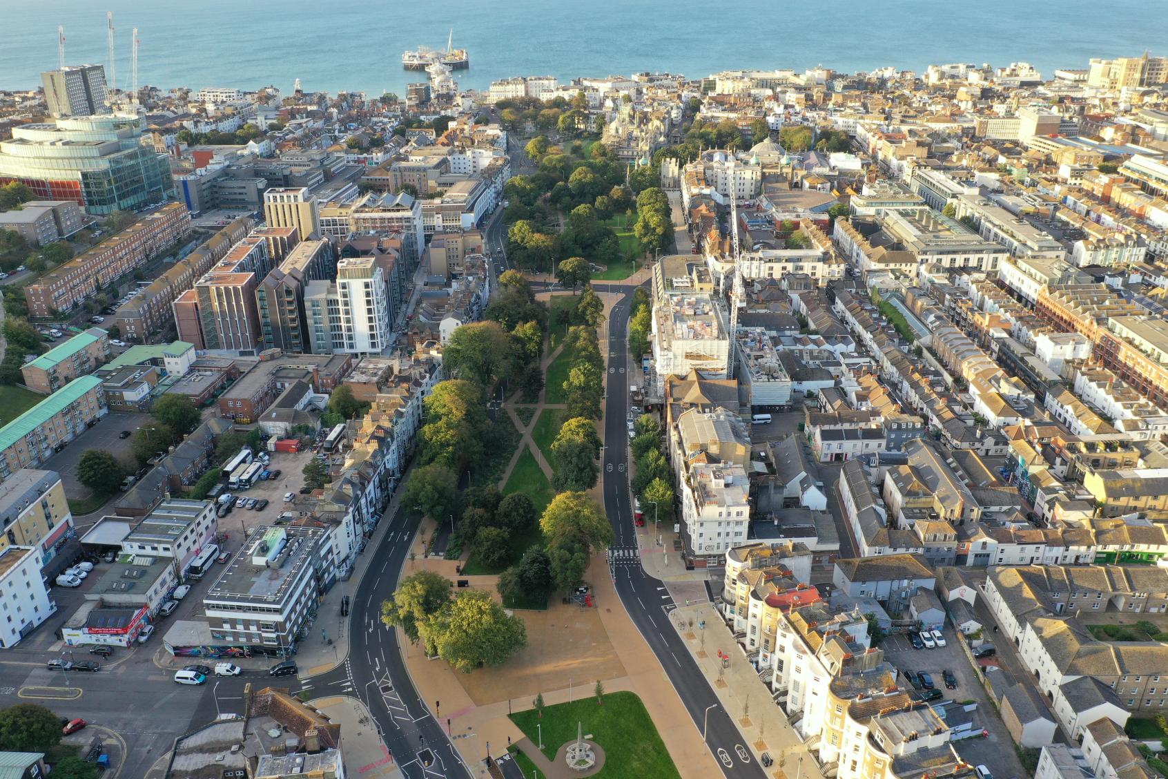 lots of buildings and the ocean photographed from above