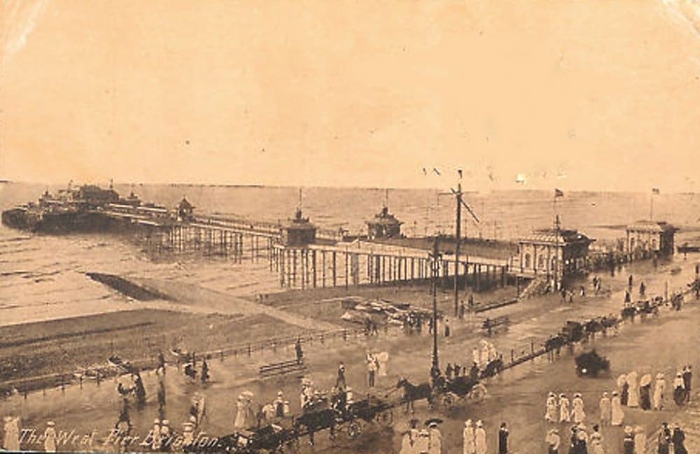 An old sepia photo showing the West Pier in Brighton