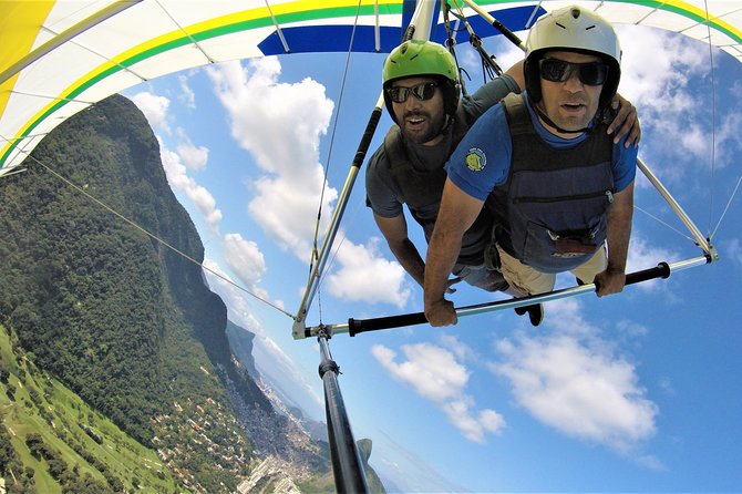 Two men in helmets flying through the sky