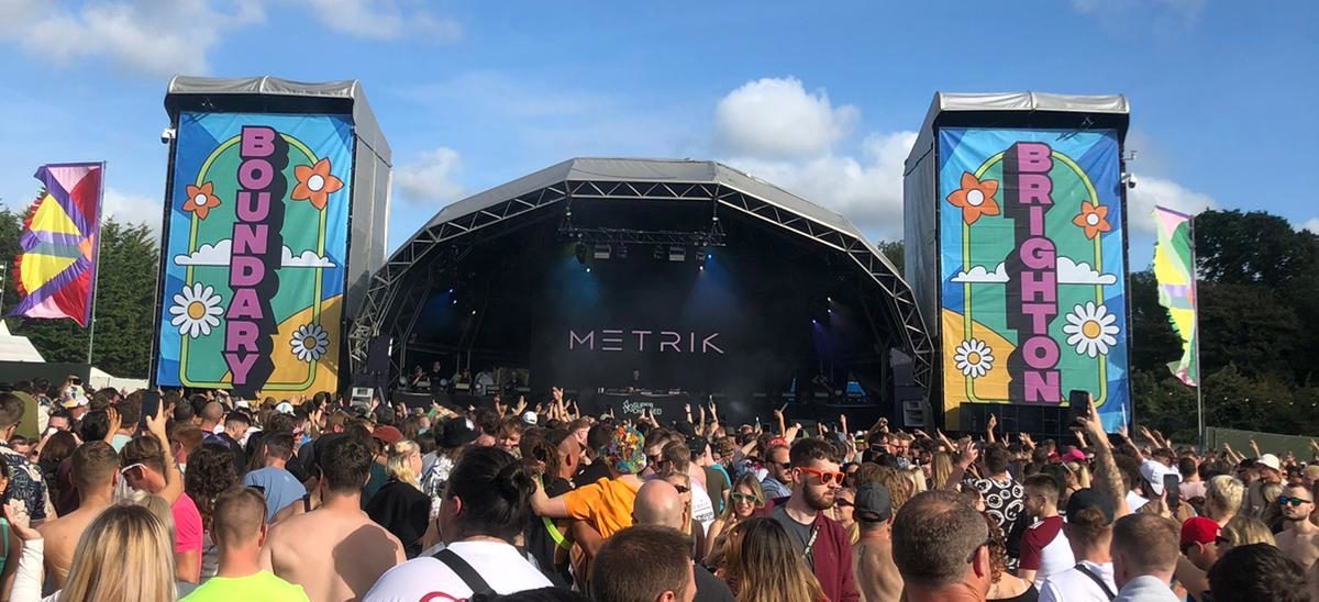 group of people in front of a stage