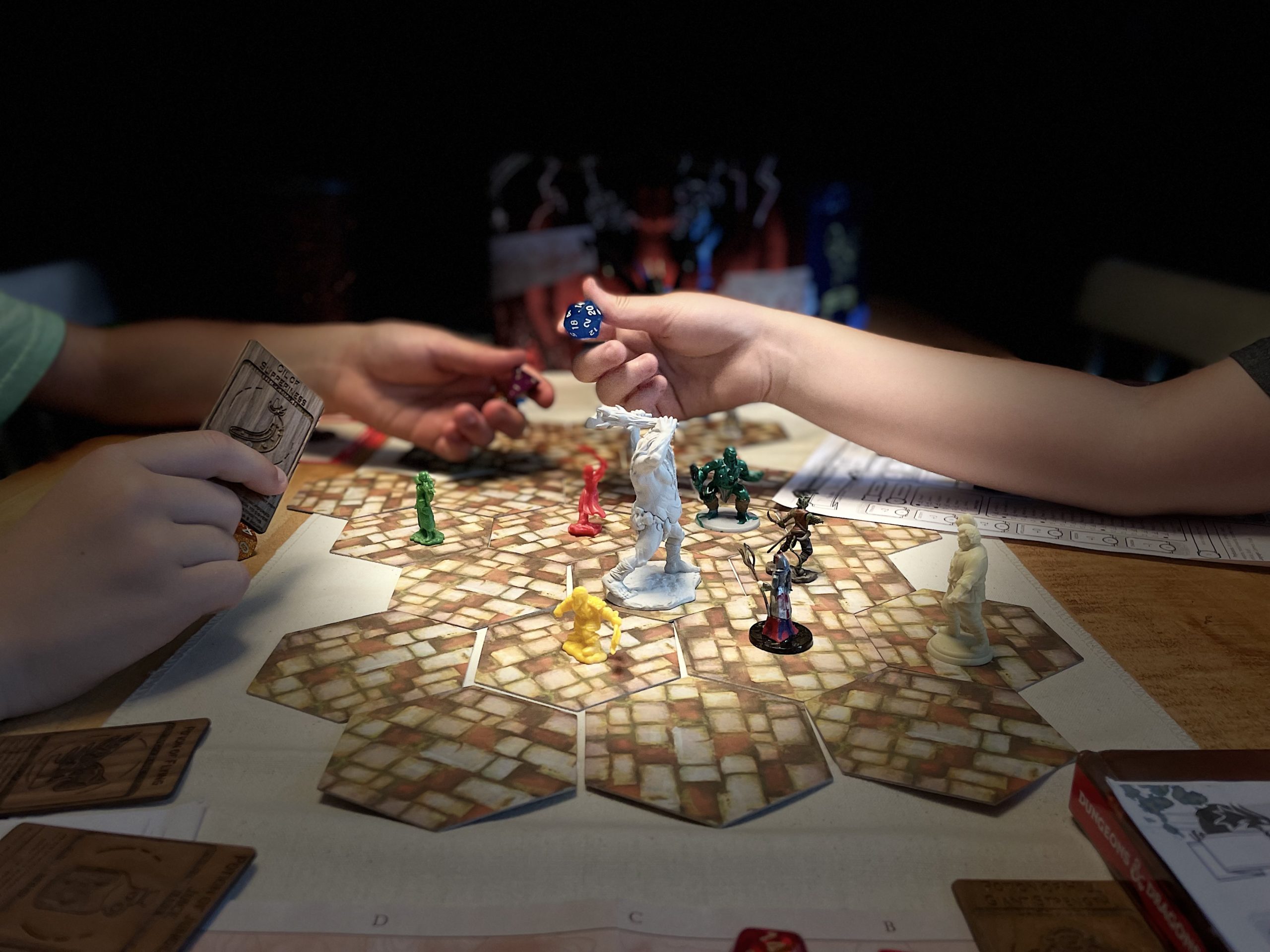 A board game set up on a table with pawns