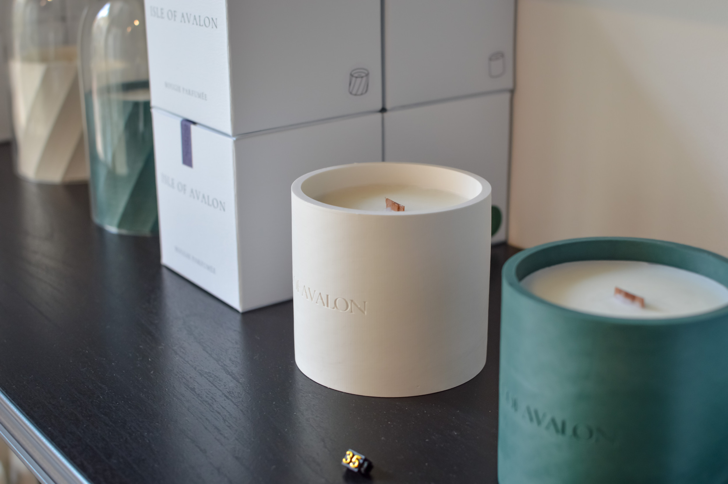 White and green candle on display at Isle of Avalon located in Dukes Lane in Brighton.