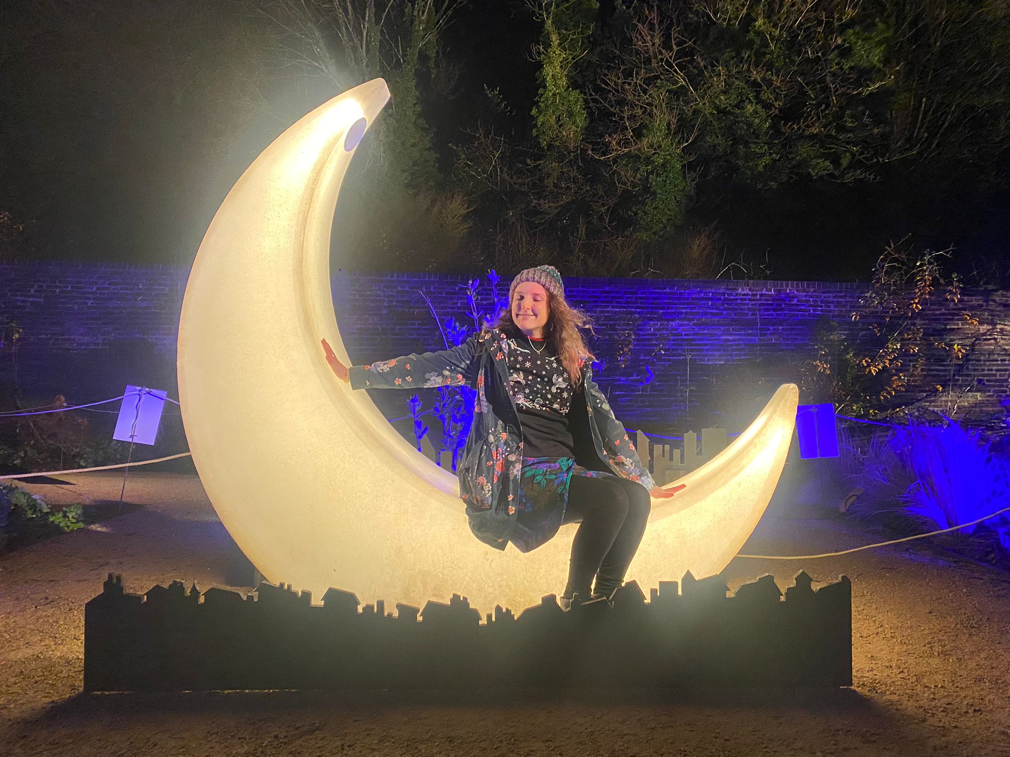 Becky sitting on a moon light at The Brighton Lights  in Stanmer Park