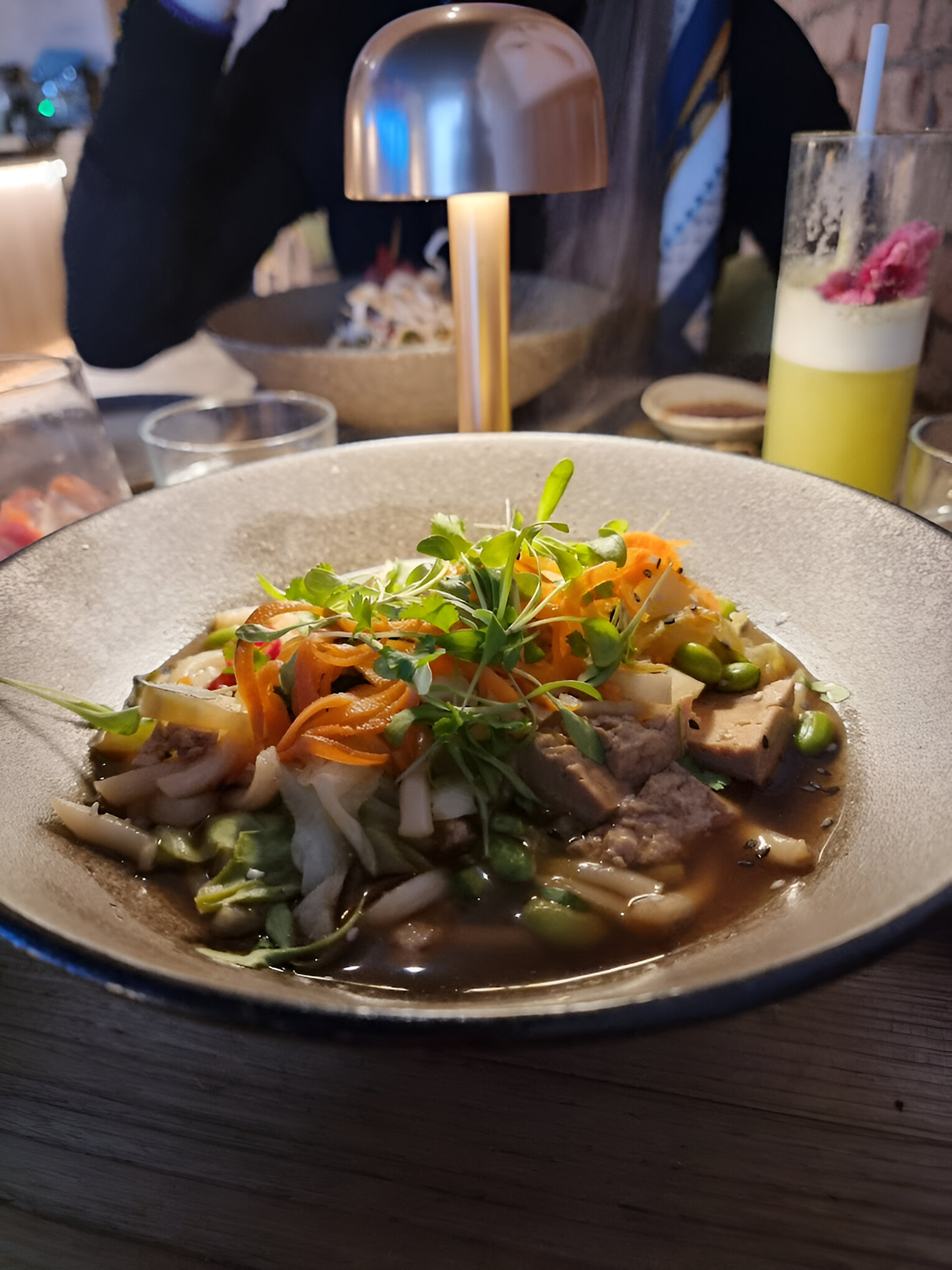 bowl of ramen with meat and carrots and greens at Kusaki in Brighton