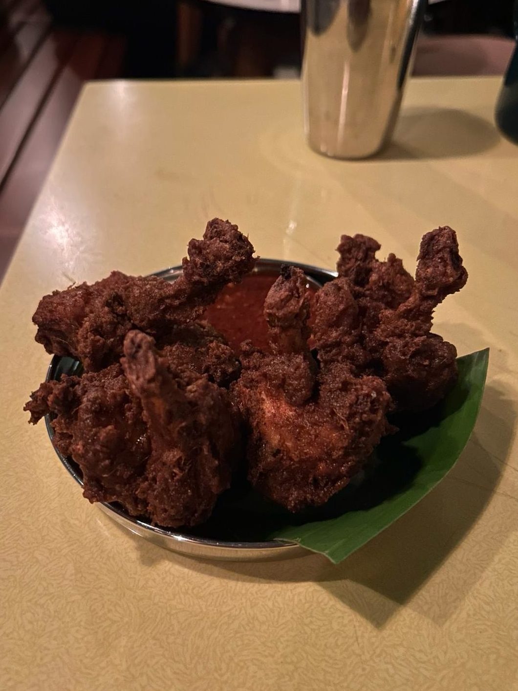 The Chicken Pick-Me-Ups, an Indo-Chinese inspired dish, featuring marinated and battered, deep-fried chicken, served alongside sweet red-chili chutney. 