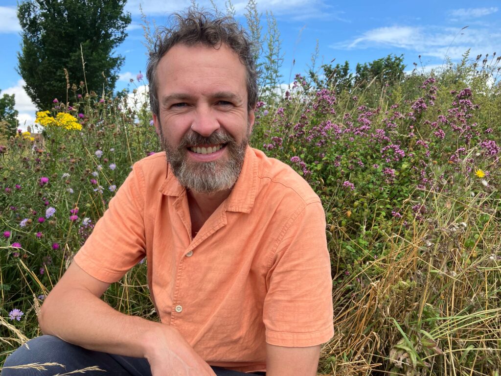 Councillor Tim Rowkins at the bee and butterfly bank in Hollingbury Park